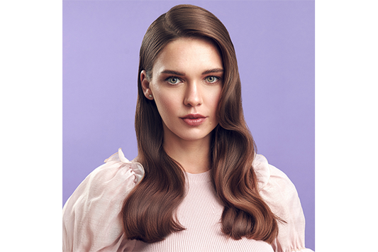 Close-up of woman with wavy brown hair