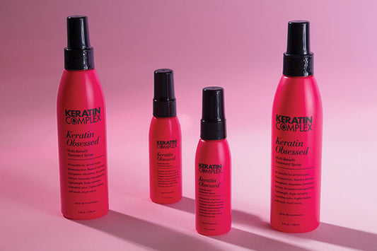 Four pink product bottles