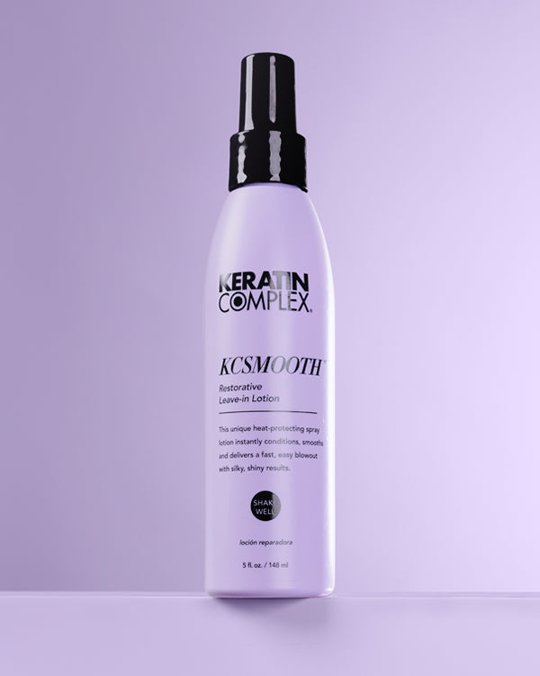 Purple bottle with black lid on Purple background