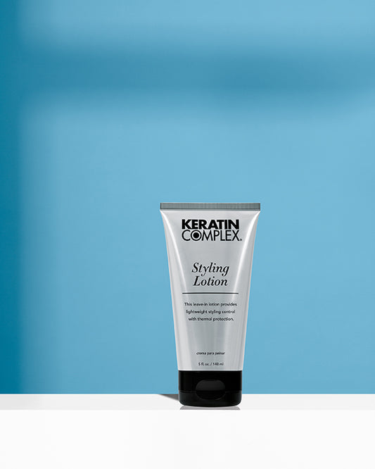 Styling Lotion bottle on blue background