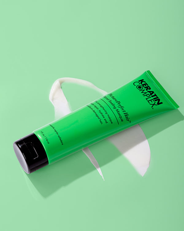 Green PicturePerfect hair masque bottle on green background