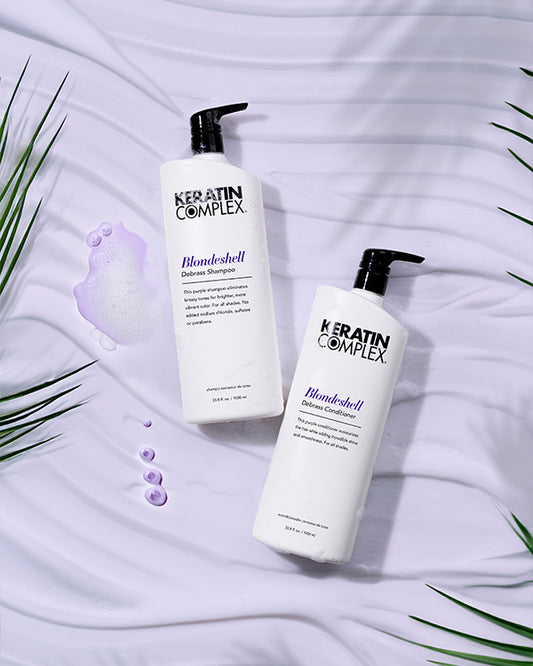 Blondeshell® Debrass Shampoo and conditioner bottle on white textured background