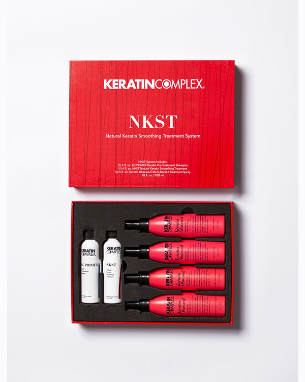 Red open NKST box showing bottle and aftercare on white background