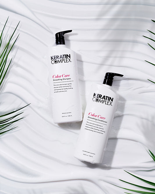 Color Care Smoothing Shampoo and conditioner liter bottle on a white textured background