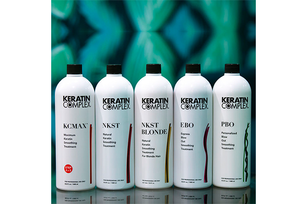 Five white bottles of keratin complex