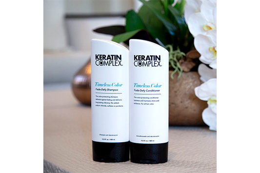 Two bottles of keratin complex on a table