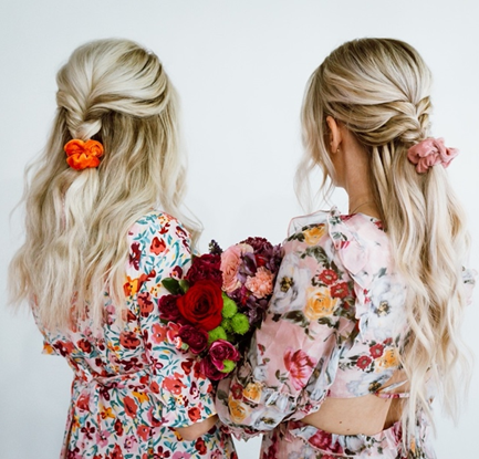 two girls with braids and flowers 
