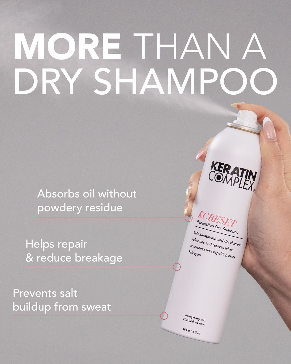 A hand holds a white can of Keratin Complex KCRESET ||MORE THAN A DRY SHAMPOO. Absorbs oil without powdery residue, Helps repair & reduce breakage, Prevents salt buildup from sweat