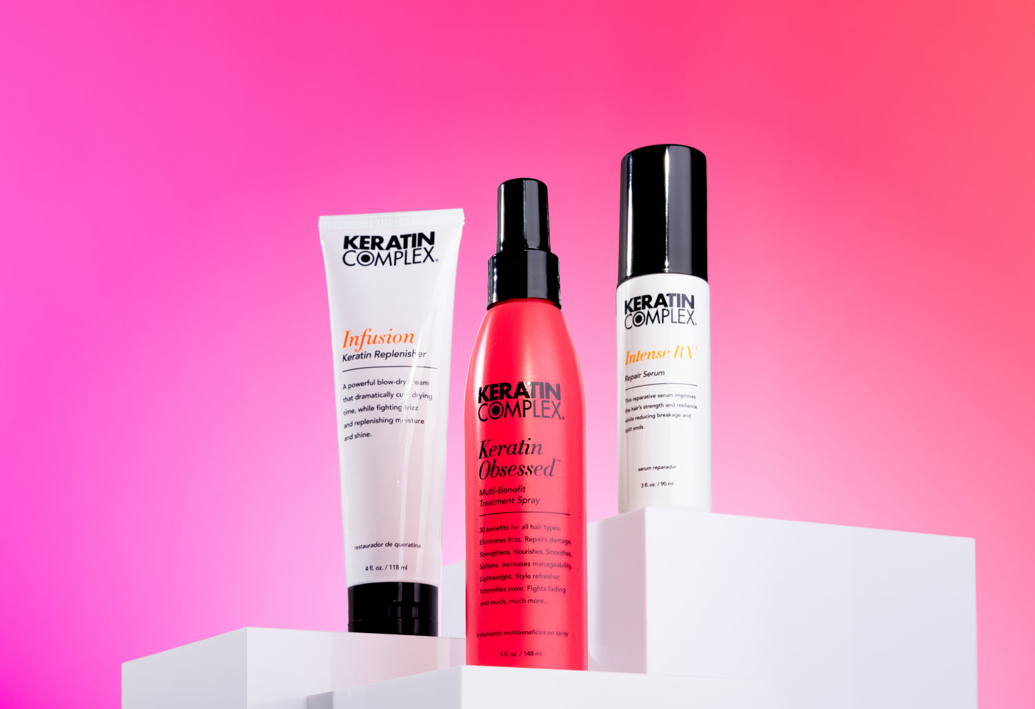 Infusion, Keratin Obsessed and Intense RX displayed on white pedestal against pink background. 