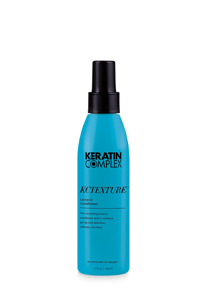 A blue bottle of KCTEXTURE Leave-In Conditioner on a white background, emphasizing its moisturizing and curl-enhancing properties.