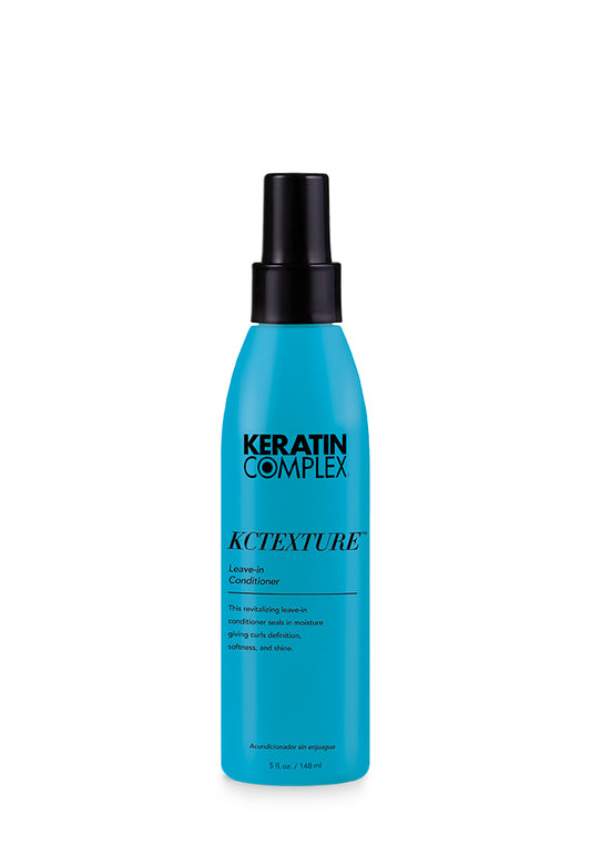 A blue bottle of KCTEXTURE Leave-In Conditioner on a white background, emphasizing its moisturizing and curl-enhancing properties.