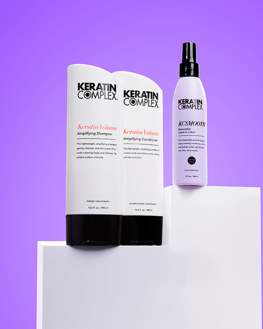 Keratin Volume Shampoo and Conditioner and KCSMOOTH Leave-In on a purple background