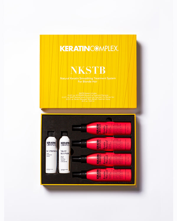 Yellow open NKSTB box showing bottle and aftercare on white background 