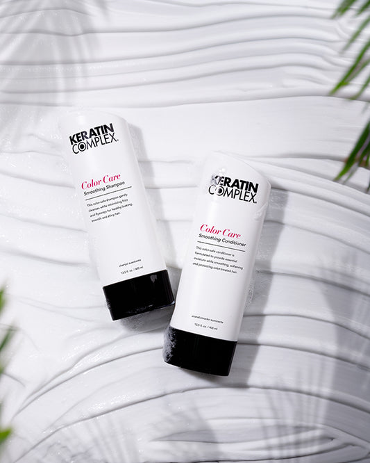 Color Care Smoothing Shampoo and conditioner bottle on a white textured background