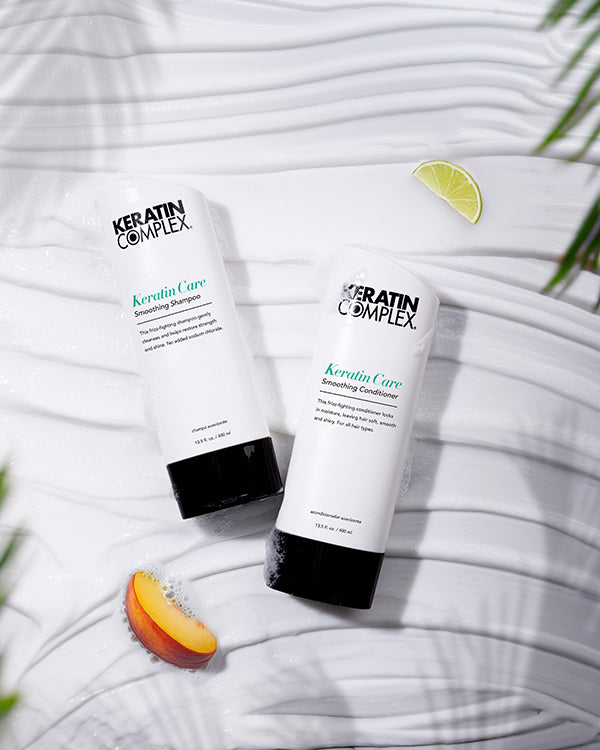 Keratin Care Smoothing Shampoo and conditioner on a white textured background with limes