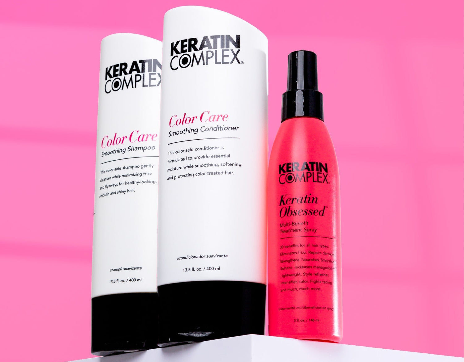 Shampoo, conditioner and blow dry aid on pink background